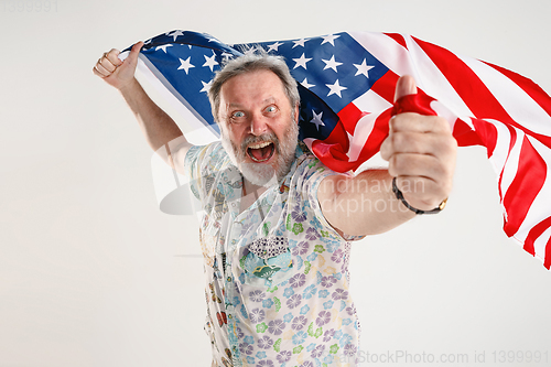 Image of Senior man with the flag of United States of America