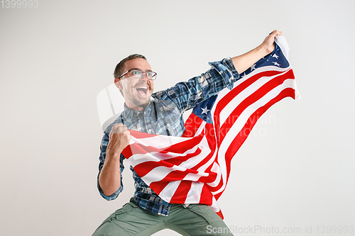 Image of Young man with the flag of United States of America