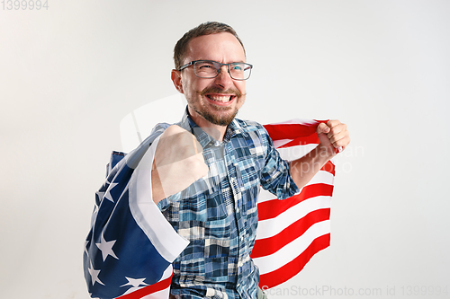 Image of Young man with the flag of United States of America