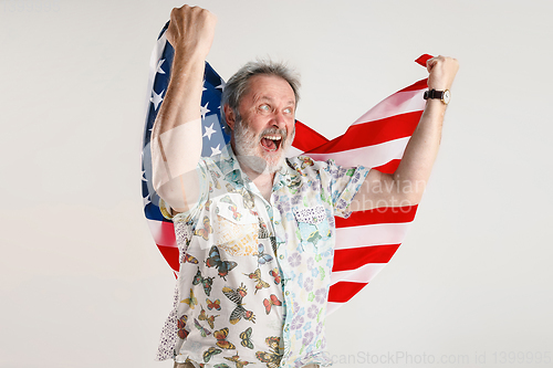 Image of Senior man with the flag of United States of America