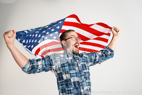 Image of Young man with the flag of United States of America