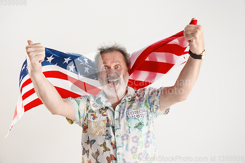 Image of Senior man with the flag of United States of America