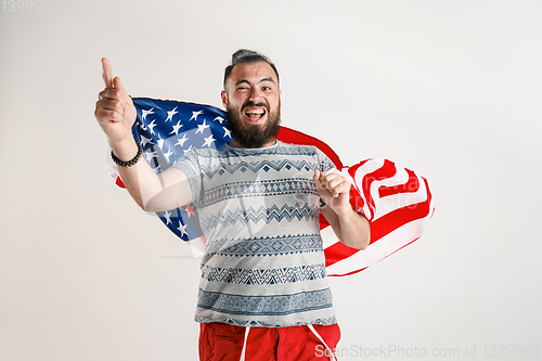 Image of Young man with the flag of United States of America