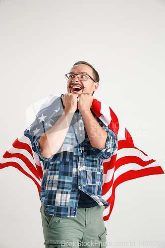 Image of Young man with the flag of United States of America