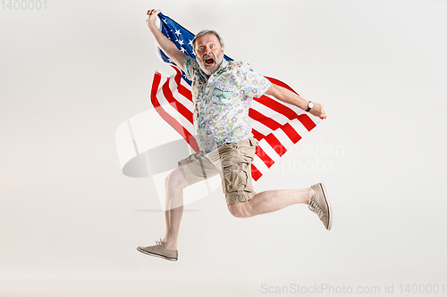 Image of Senior man with the flag of United States of America