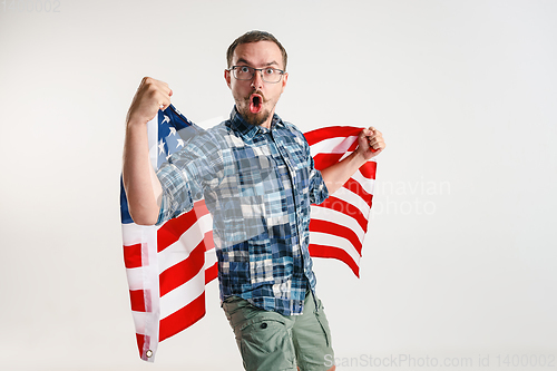 Image of Young man with the flag of United States of America