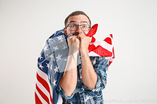 Image of Young man with the flag of United States of America