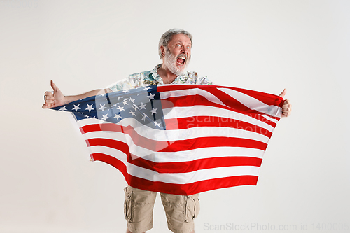 Image of Senior man with the flag of United States of America