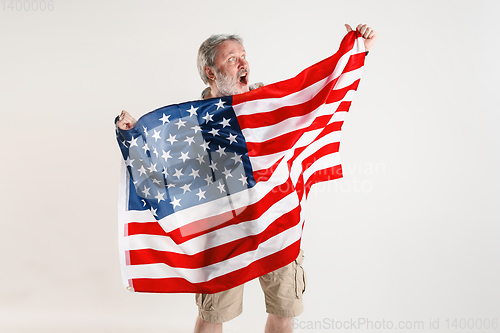 Image of Senior man with the flag of United States of America