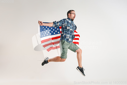 Image of Young man with the flag of United States of America