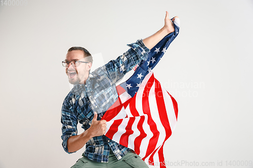 Image of Young man with the flag of United States of America