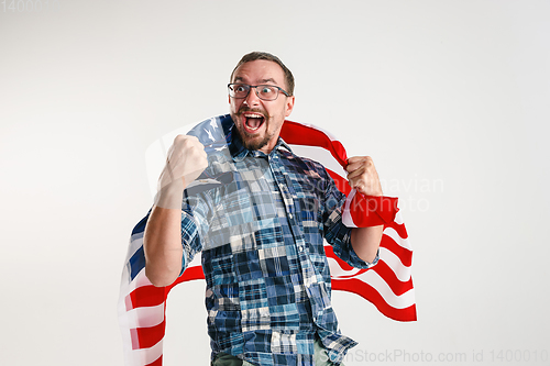 Image of Young man with the flag of United States of America