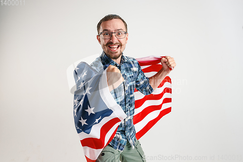 Image of Young man with the flag of United States of America