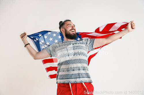 Image of Young man with the flag of United States of America