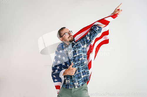 Image of Young man with the flag of United States of America