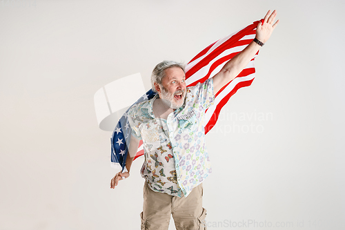 Image of Senior man with the flag of United States of America