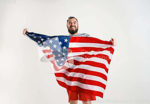 Image of Young man with the flag of United States of America