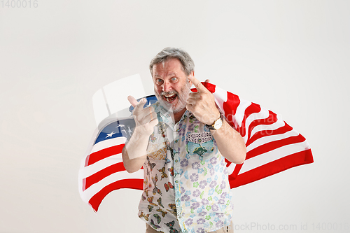 Image of Senior man with the flag of United States of America