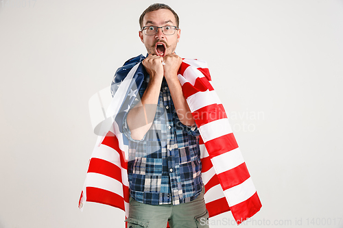 Image of Young man with the flag of United States of America