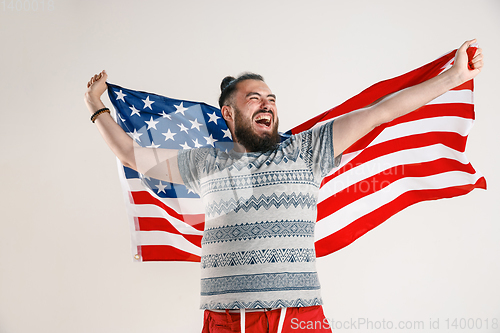 Image of Young man with the flag of United States of America