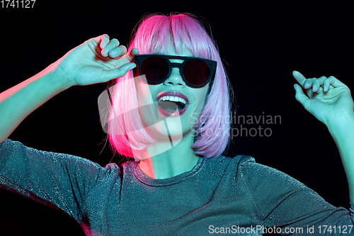 Image of happy woman in pink wig and black sunglasses