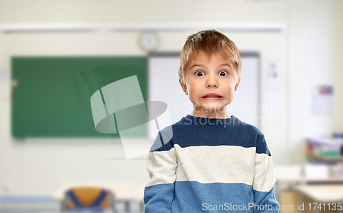 Image of shocked little boy at school