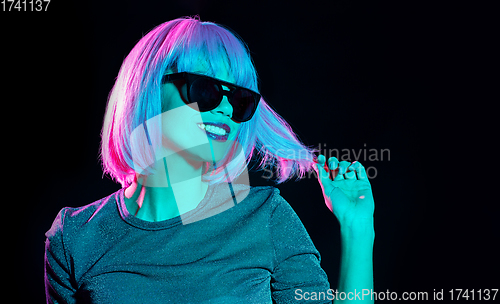 Image of happy woman in pink wig and black sunglasses