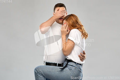 Image of scared couple in white t-shirts