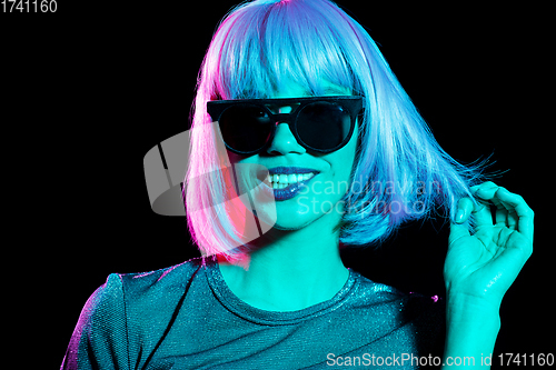 Image of happy woman in pink wig and black sunglasses