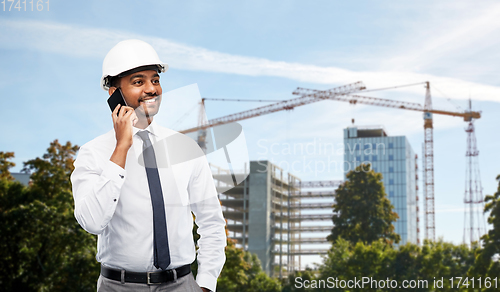 Image of architect calls on smartphone at construction site