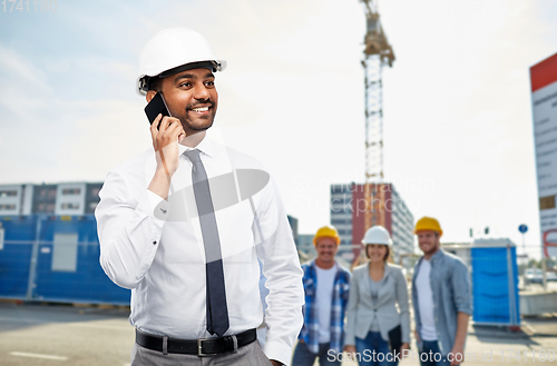 Image of architect calls on smartphone at construction site