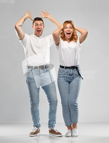 Image of portrait of happy couple in white t-shirts