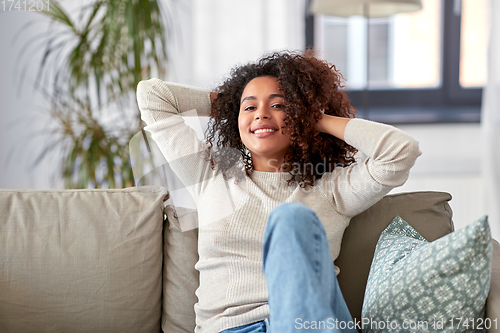 Image of happy african american young woman at home