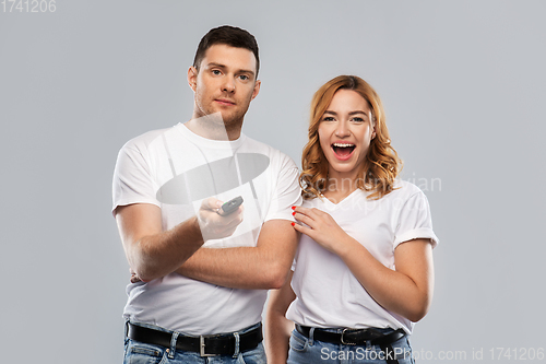 Image of couple with tv remote control