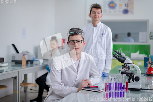 Image of Group of young medical students doing research