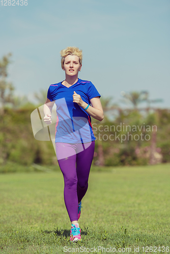 Image of young female runner training for marathon