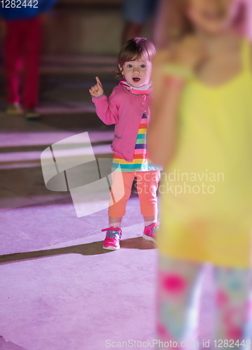 Image of little girl dancing in the kids disco