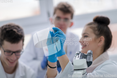 Image of Group of young medical students doing research