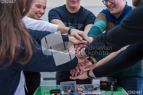 Image of students celebrating successfully finished project