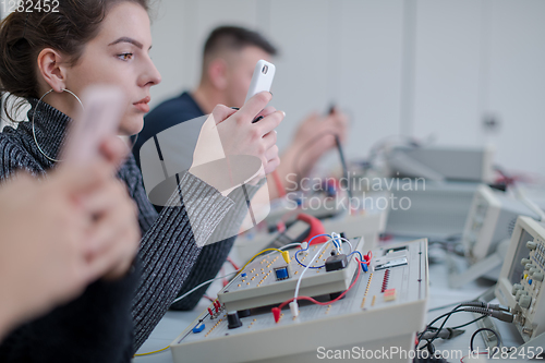Image of female student using a mobile phone