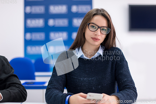 Image of female student using a mobile phone