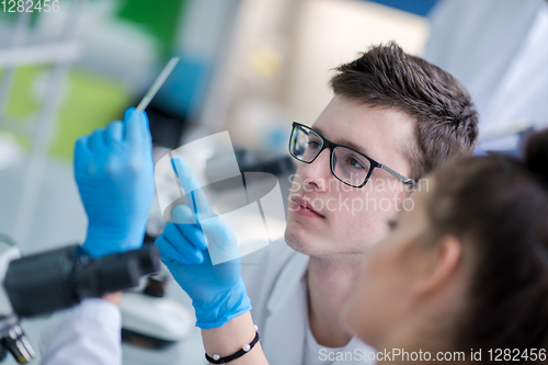 Image of Group of young medical students doing research