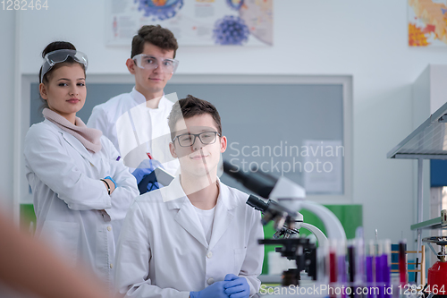 Image of Group of young medical students doing research