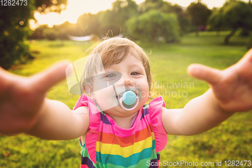 Image of little girl spending time at backyard