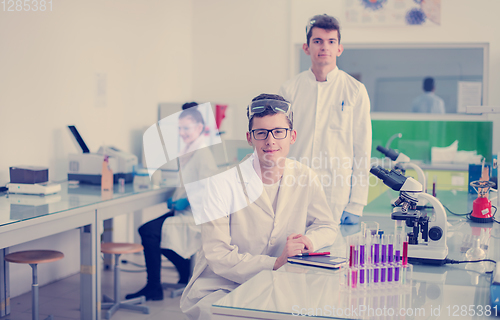 Image of Group of young medical students doing research