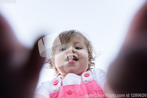 Image of little girl spending time at backyard