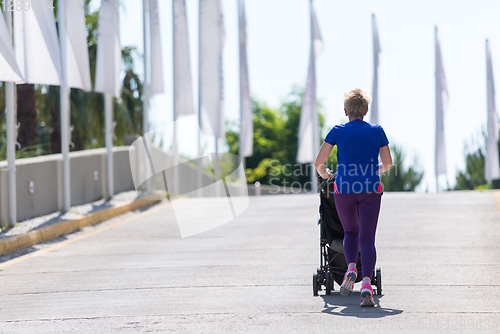 Image of mom with baby stroller jogging