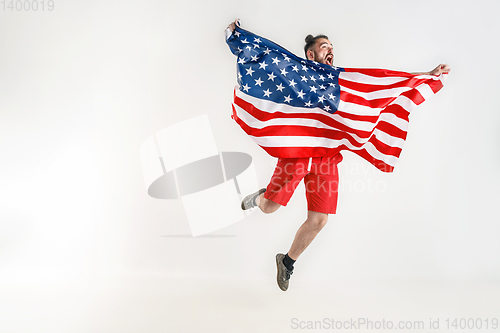 Image of Young man with the flag of United States of America