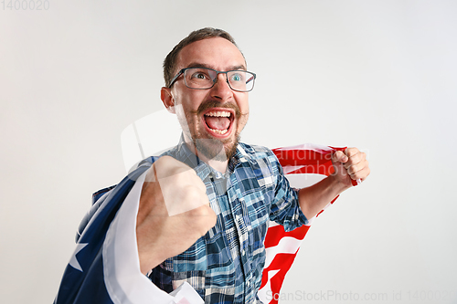 Image of Young man with the flag of United States of America