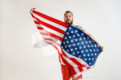 Image of Young man with the flag of United States of America